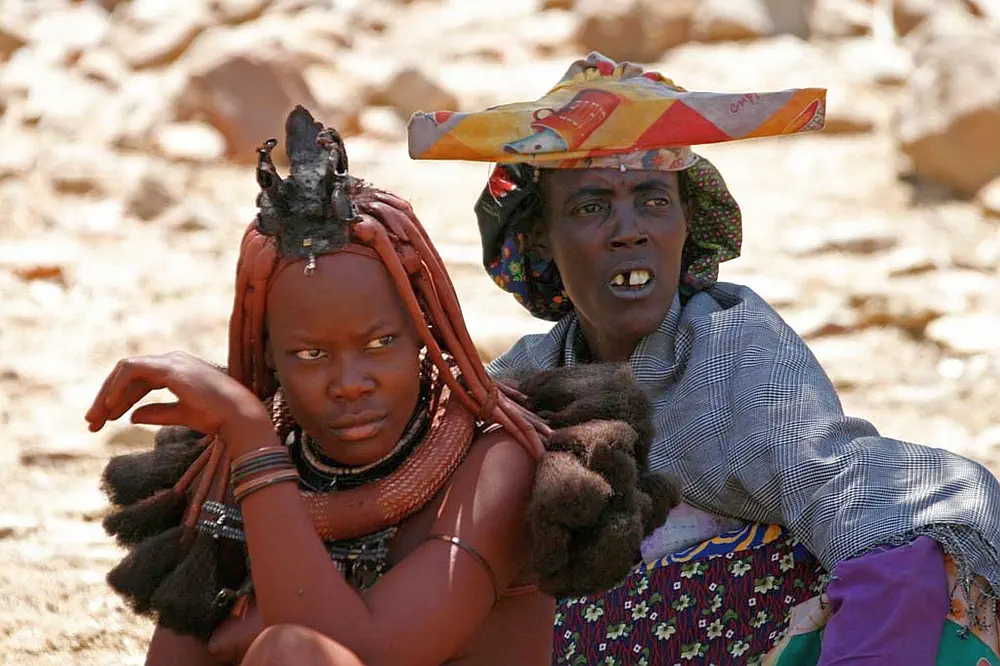 Herero women wear striking, Victorian-style gowns and horn-shaped headdresses